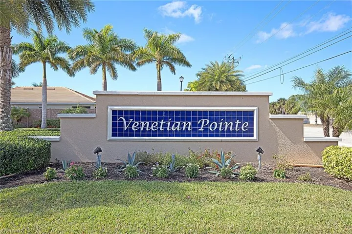 Community / neighborhood sign with a lawn