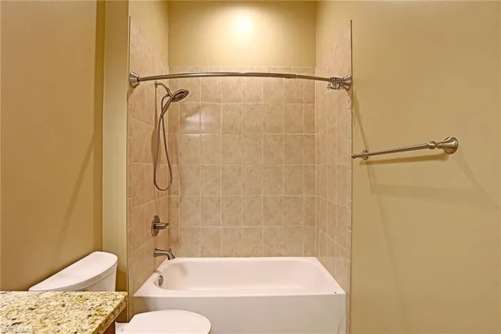 Bathroom featuring vanity and bathtub / shower combination