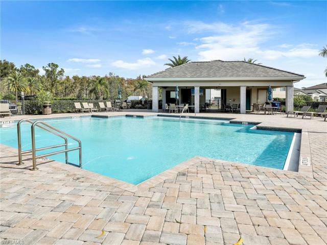 Community Pool with BBQ's, restrooms, and table and chairs.