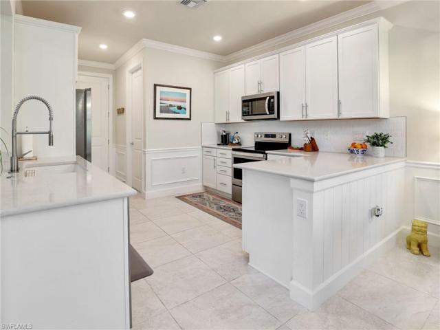 Quartz counters, Blanco sink and beautiful backsplash
