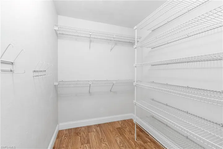 Walk in closet featuring light wood-style floors
