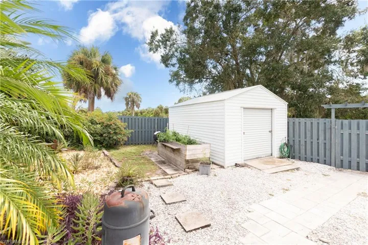 Fenced backyard with a shed