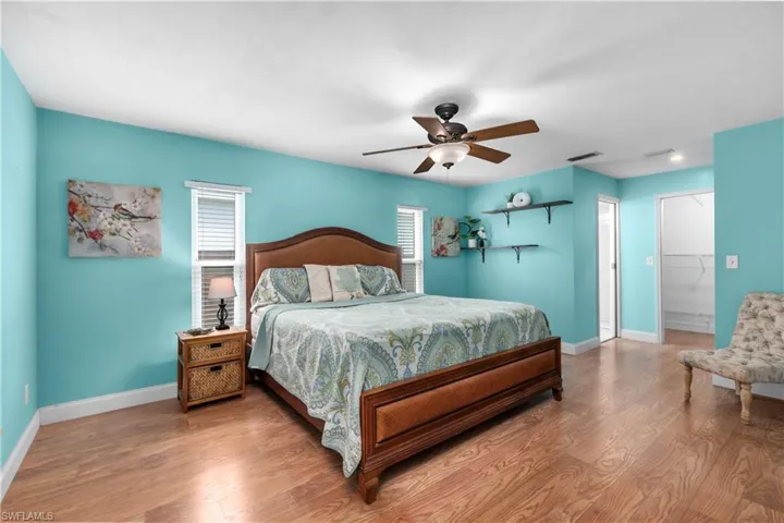 Bedroom with wood finished floors and a ceiling fan