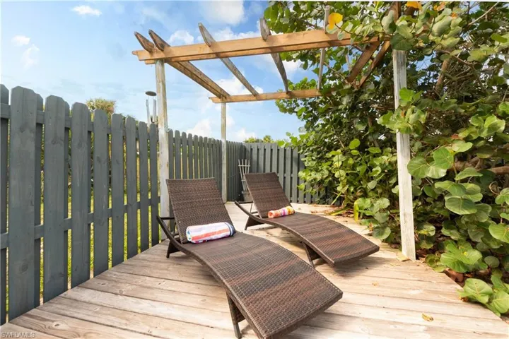 Deck featuring a pergola