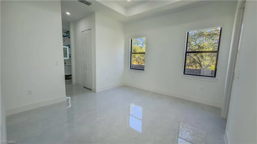 Unfurnished room featuring baseboards and recessed lighting
