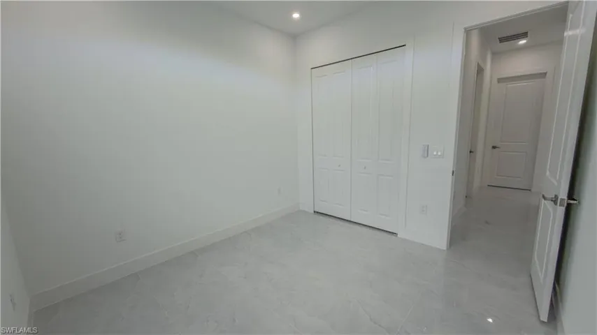 Unfurnished bedroom featuring a closet and recessed lighting