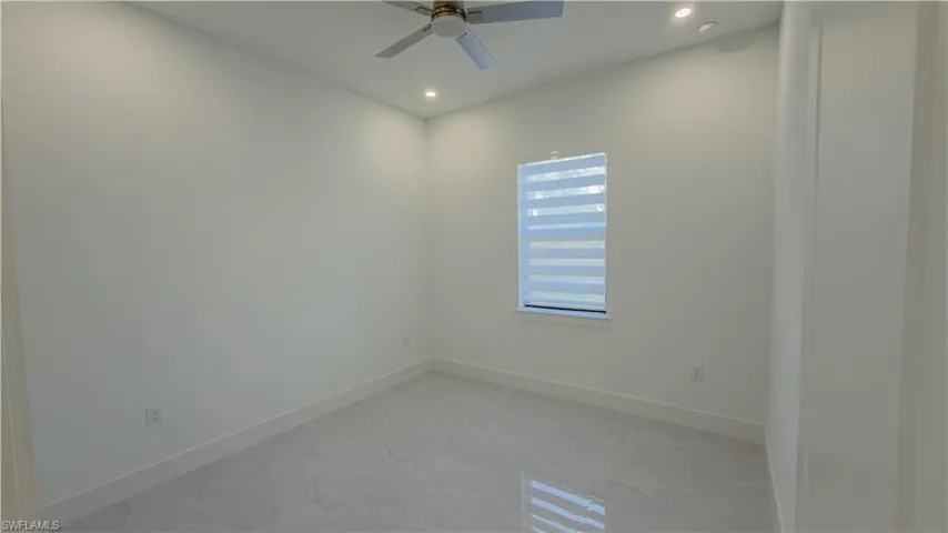 Unfurnished room featuring ceiling fan and recessed lighting
