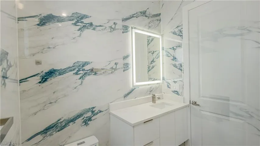 Bathroom with vanity and toilet