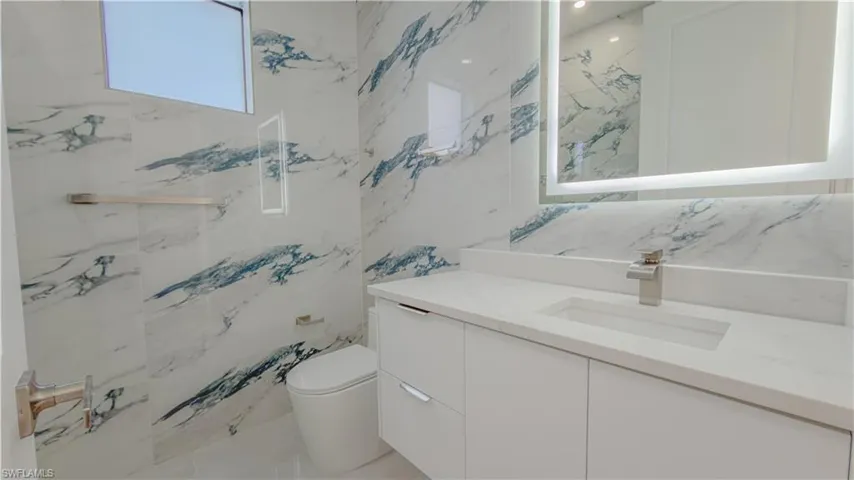 Bathroom with vanity and toilet
