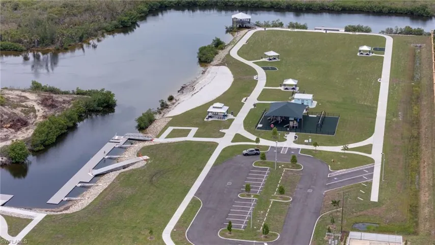 Nearby Tropicana park with covered playground area, multiple gazebos, and walking paths.