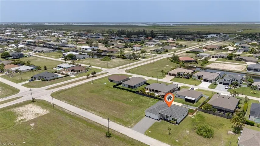 Aerial perspective of a residential neighborhood featuring single-story homes