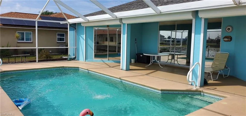 Pool with a lanai and a patio area
