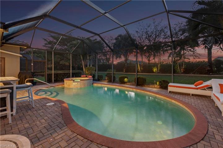 Landscape lighting behind cage and on trees on timers
