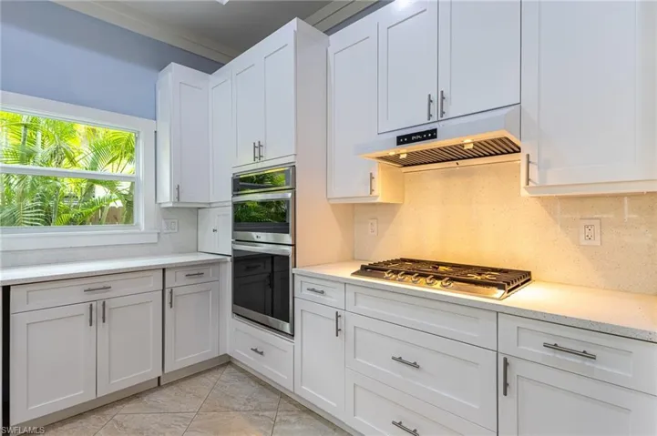 Upgraded cabinetry with gas cooktop.