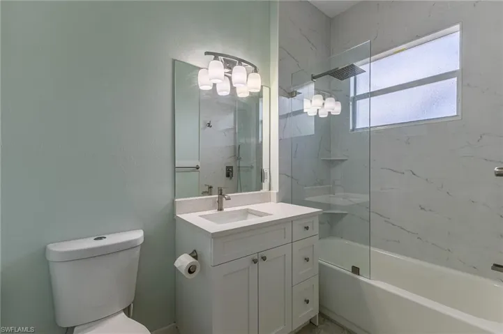 Bathroom with vanity and washtub / shower combination. All newly updated.