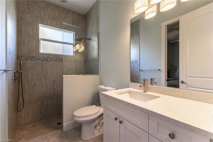 Full bathroom featuring vanity and walk in shower, 3rd Bathroom nicely updated.