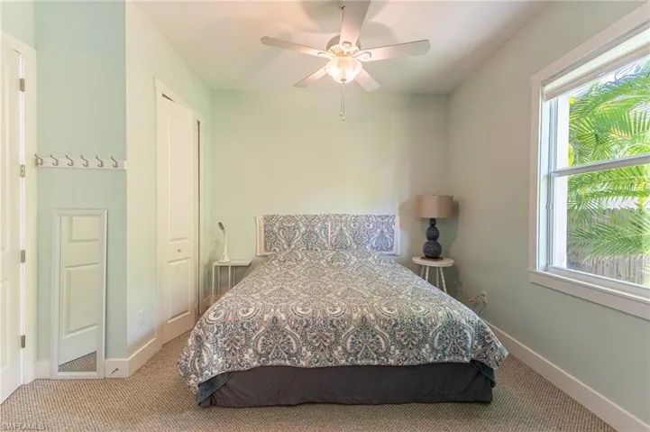 3rd guest Bedroom with carpet floors, a closet, and a ceiling fan