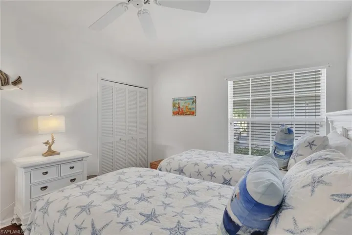 Bedroom with a closet and ceiling fan