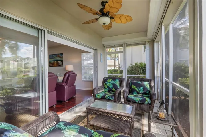 Sunroom / solarium with ceiling fan and an outdoor hangout area
