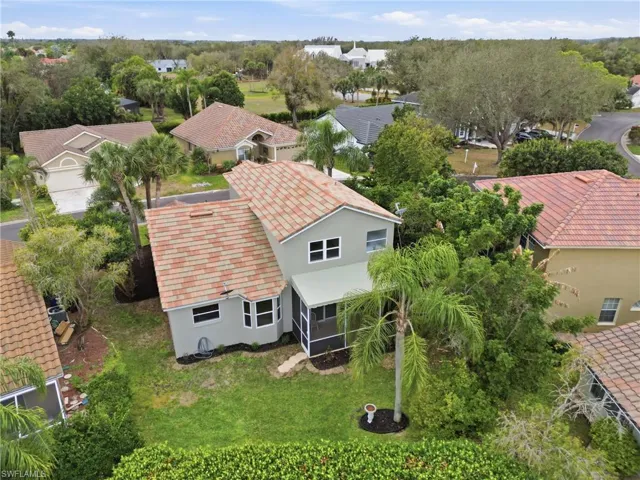 Aerial perspective of suburban area featuring a tree filled landscape