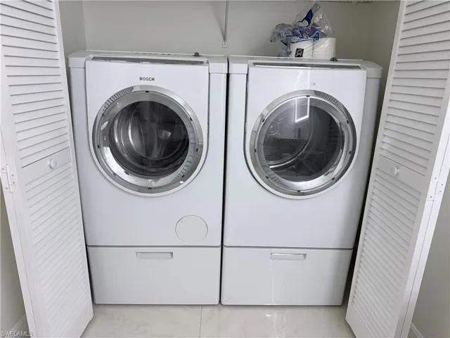 Laundry area featuring separate washer and dryer