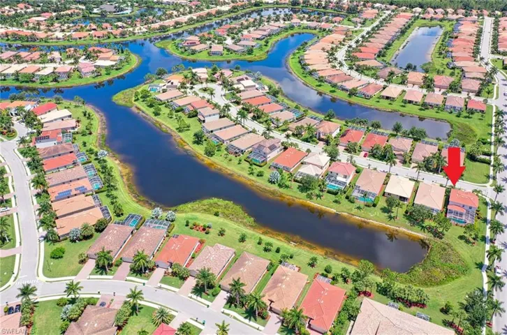 Aerial overview of property's location featuring nearby suburban area and a large body of water