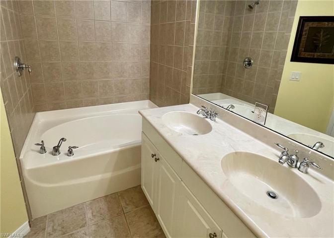 Primary Bathroom feat water closet and linen closet