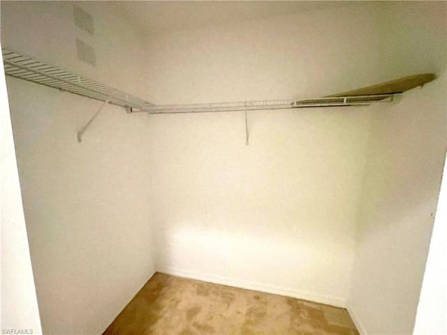 Primary walk-in closet (2 total closets in primary)