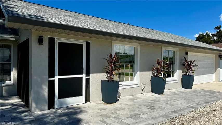 View of patio / terrace with a garage