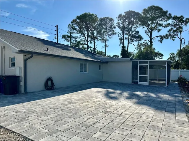 Back of house with a patio
