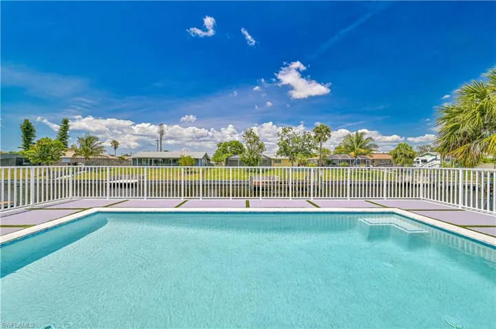 View of pool featuring a fenced backyard and a residential view