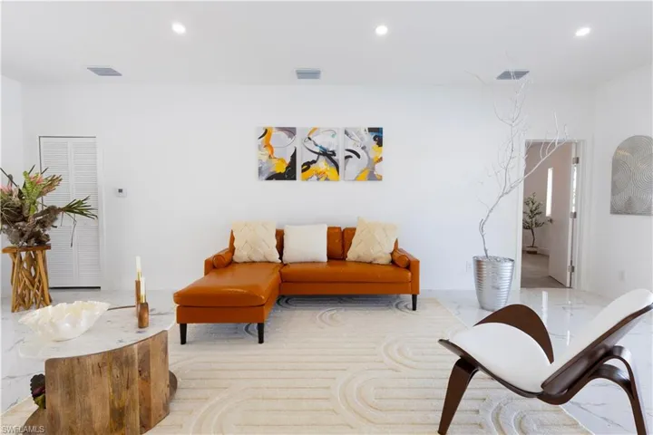 Living area featuring recessed lighting and carpet flooring