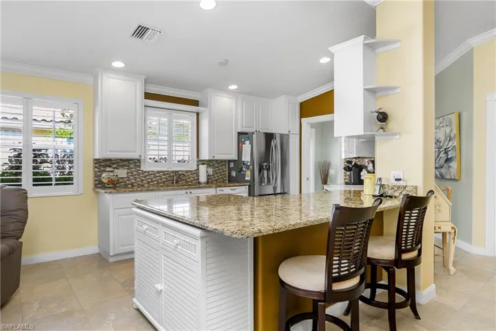 Granite Counters with stylish backsplash