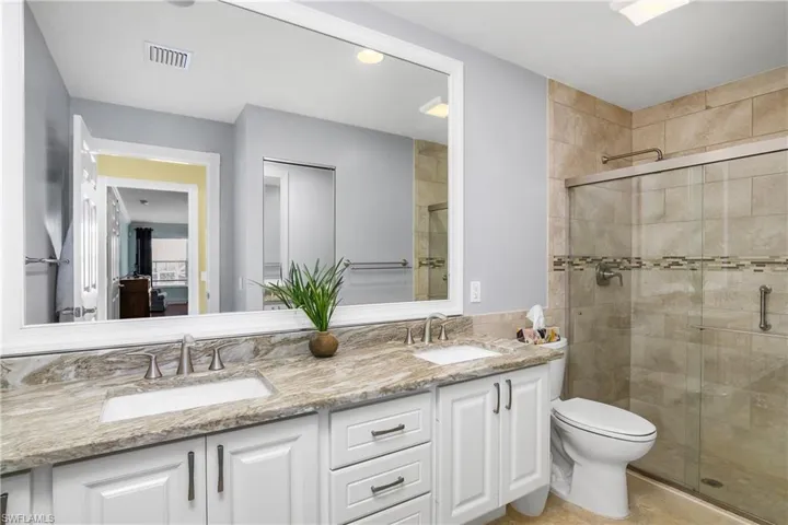 Updated Bath with Walk in Shower and Framed mirror
