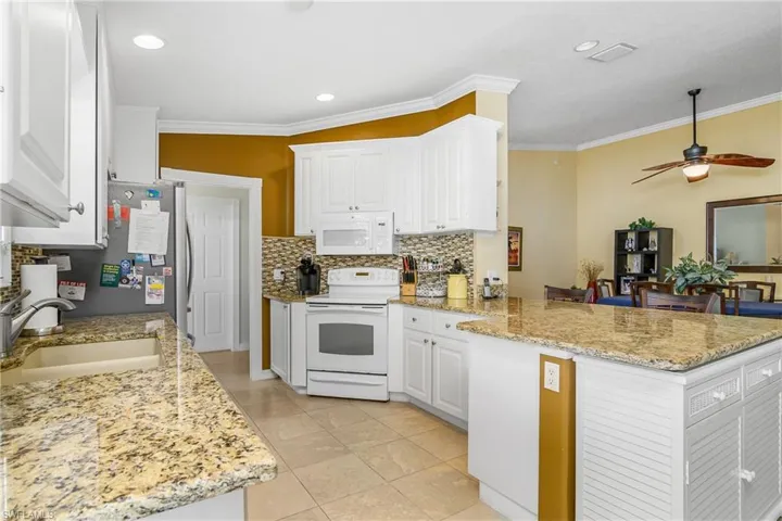 Cabinets removed to open up to dining for ease of conversation. Note cabinet underneath the end countertop