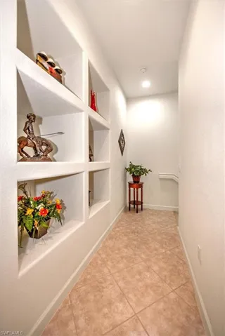 Hall featuring inset shelves