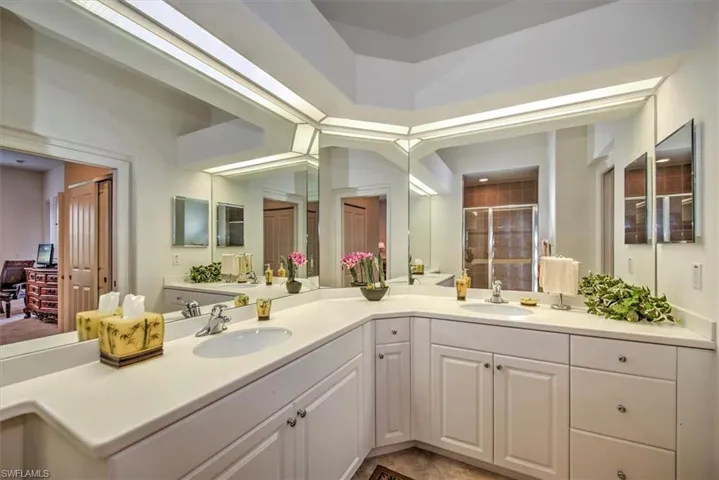 Bathroom with vanity and tile patterned flooring
