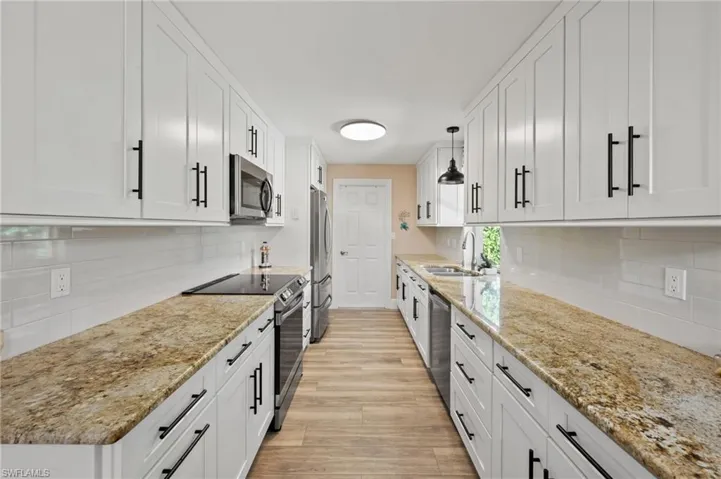 Fully remodeled Kitchen with Granite Countertops, high-end cabinetry and Stainless steel appliances