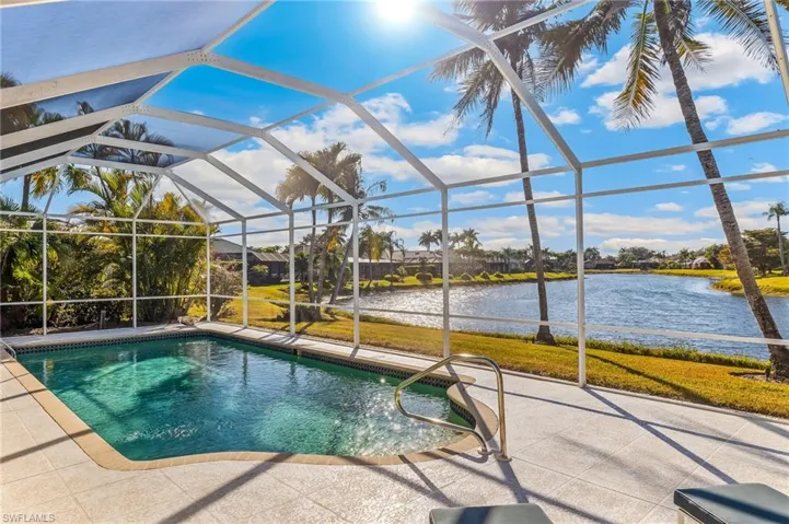 Outdoor pool area featuring a long water view