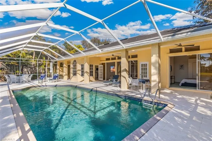 beautiful lanai/pool area featuring sun grand deck