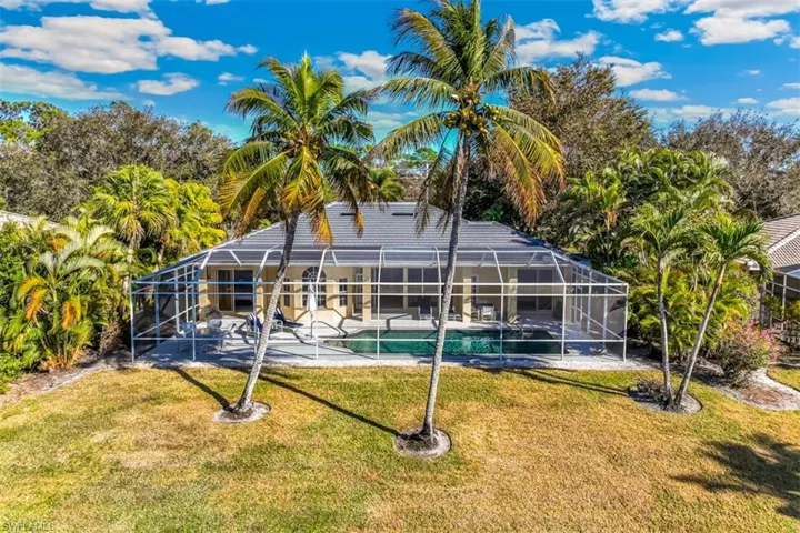 backyard and screened in lanai/pool area