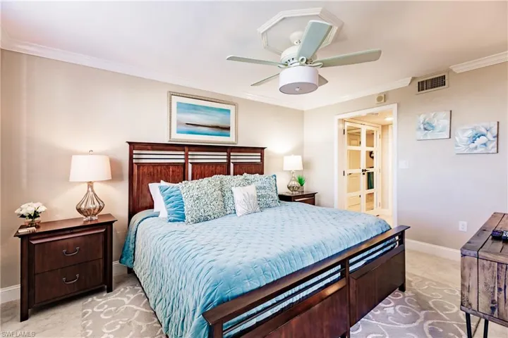 Bedroom featuring ornamental molding, baseboards, a ceiling fan, and light tile patterned floors