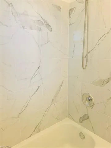 Bathroom featuring tiled shower / bath