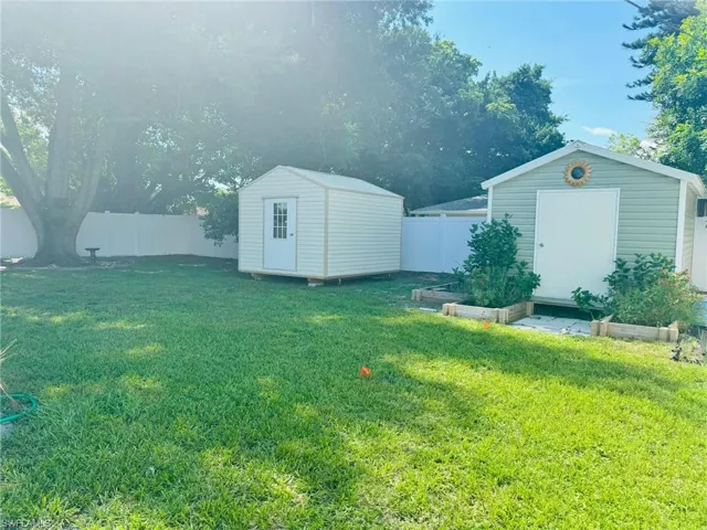 View of yard with a storage unit