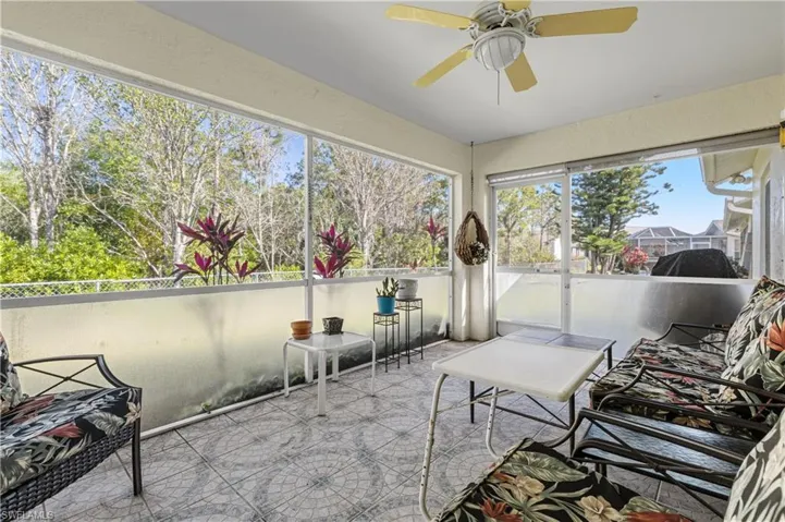 Sunroom with a ceiling fan