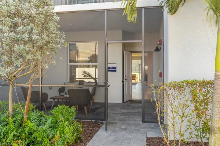 Entrance to property featuring stucco siding