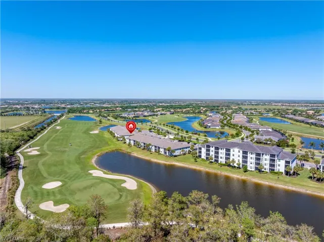 Bird's eye view with view of golf course and a water view