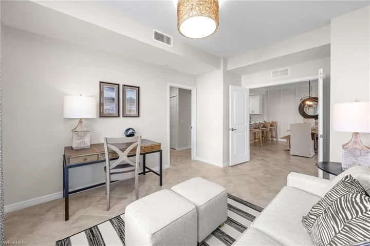 Home office with visible vents, baseboards, and light tile patterned flooring