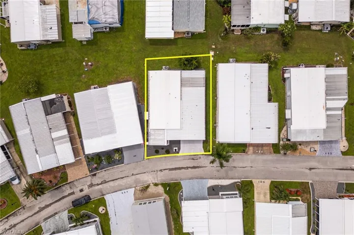 Aerial view of residential area with property boundaries highlighted