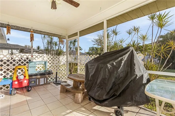 View of patio featuring grilling area and ceiling fan